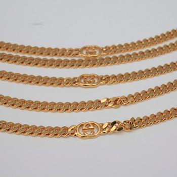 GUCCI, a necklace/belt.
