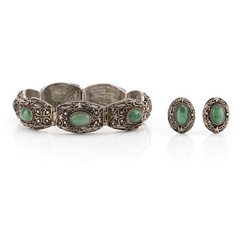 A Chinese silver and green stone bracelet and a pair of earrings, early 20th century.