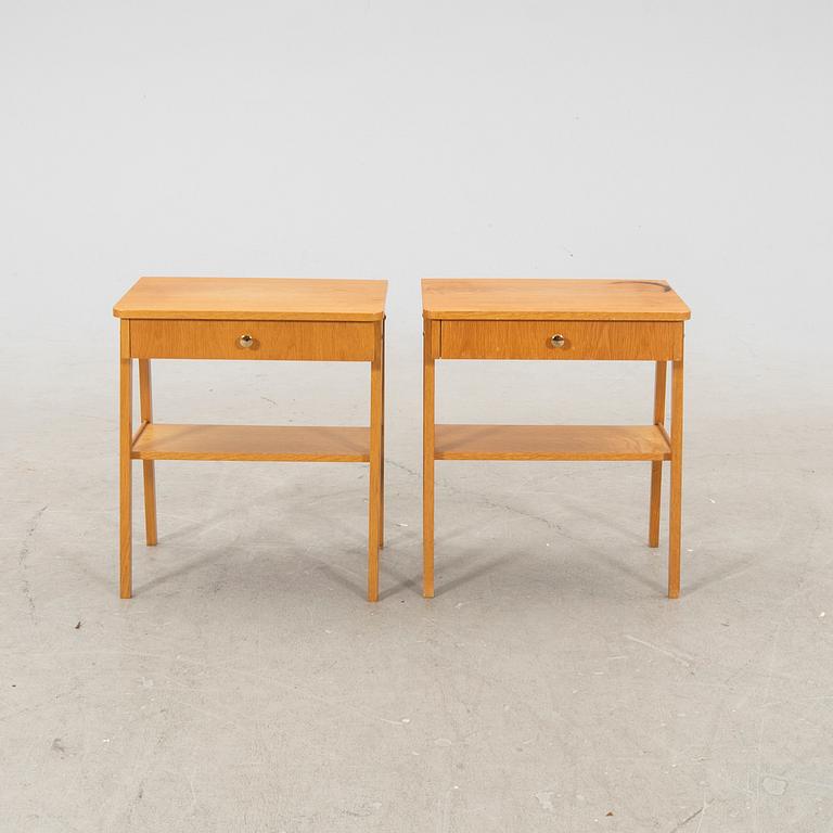 A pair of veneered bedside tables, 1950's/60's.