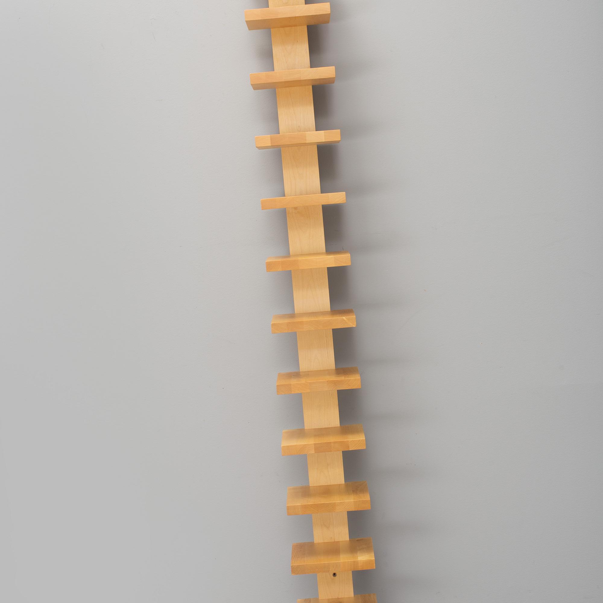 JOHN KANDELL, a "pilaster" wall shelf from the late 1900's.