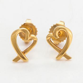Tiffany & Co, Paloma Picasso, a pair of 18K gold 'Loving Heart' earrings.