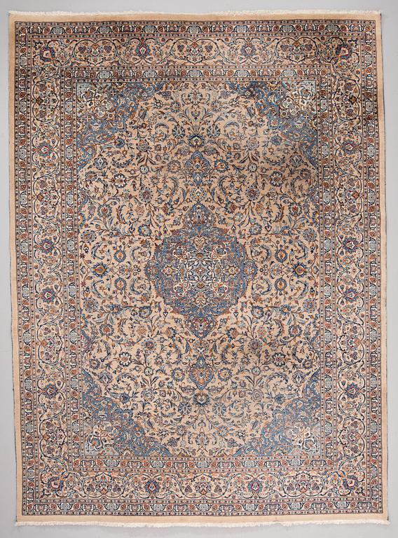 A carpet from Mashad, around 381 x 297 cm.