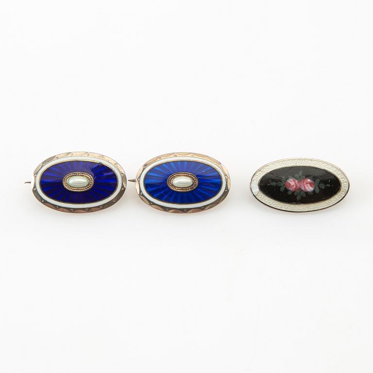 Two pendants and five brooches made of silver and enamel, including Aksel Holmsen, Norway, circa 1900.