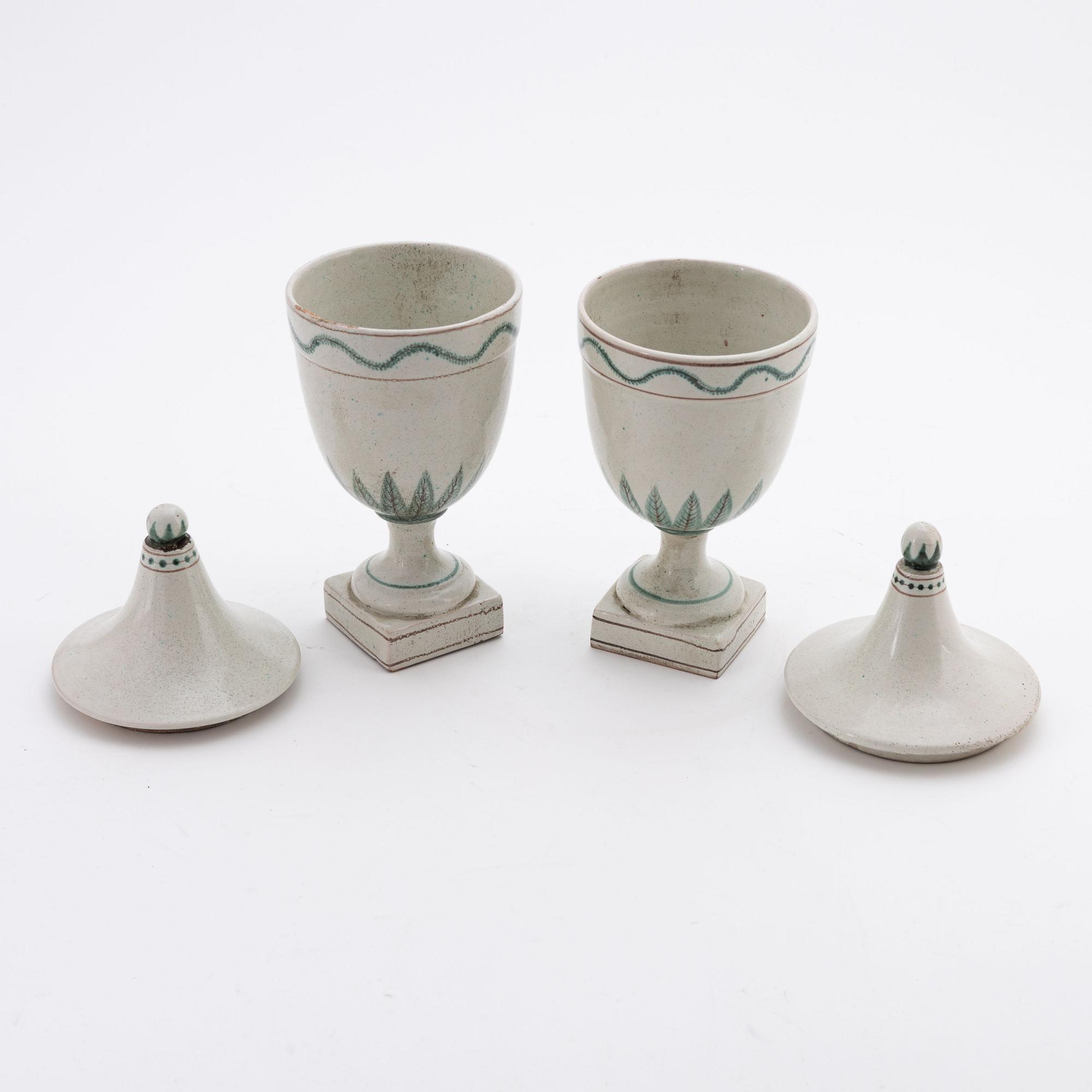 A pair of earthenware urns, 20th century.