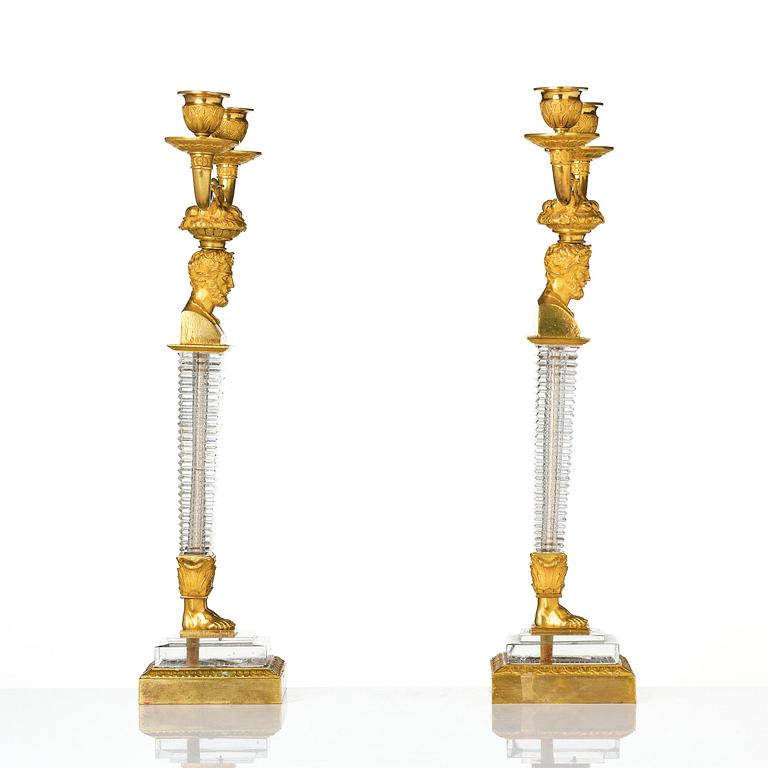 A pair of Empire ormolu and cut glass two-branch candelabra, Paris, early 19th century.