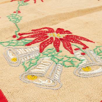 A collection of Christmas tablecloths, Christmas tree skirts, an apron, and runners, 21 pcs, 20th century.