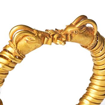 A Greco-Egyptian gold ram's head bracelet, Presumably Ptolemaic period ca 300 BC - 30 BC.