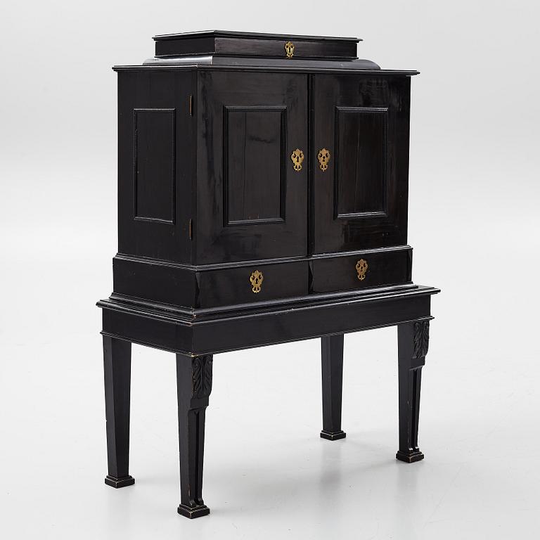 A South-German Baroque ebonized collector's cabinet on stand, circa 1700.