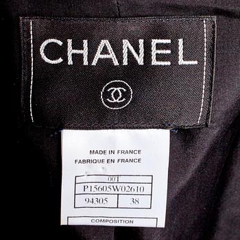 CHANEL, a two-piece suit consisting of jacket and skirt.