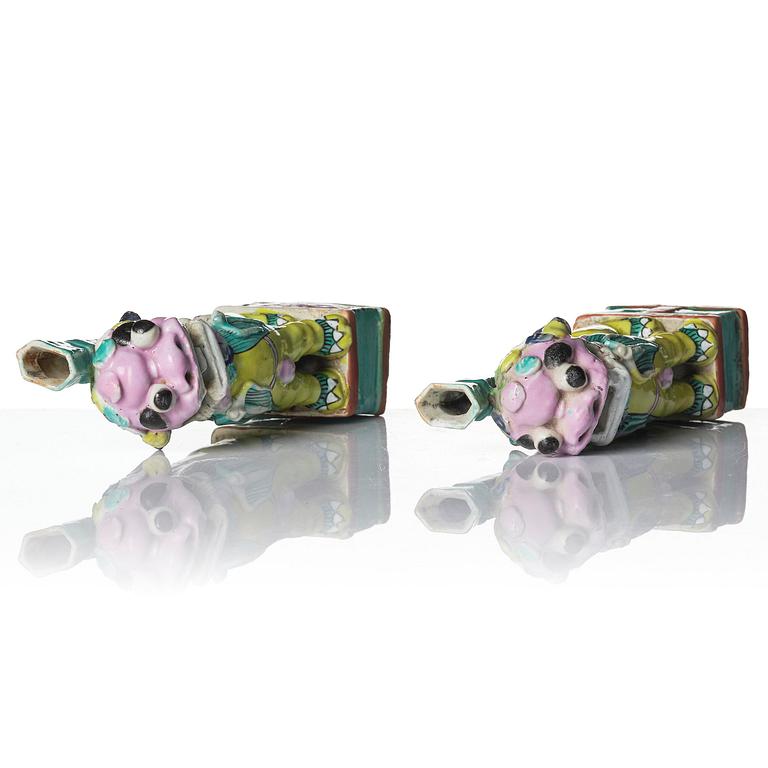 A pair of famille rose 'buddhist lion' joss stick holders, Qing dynasty, circa 1800.