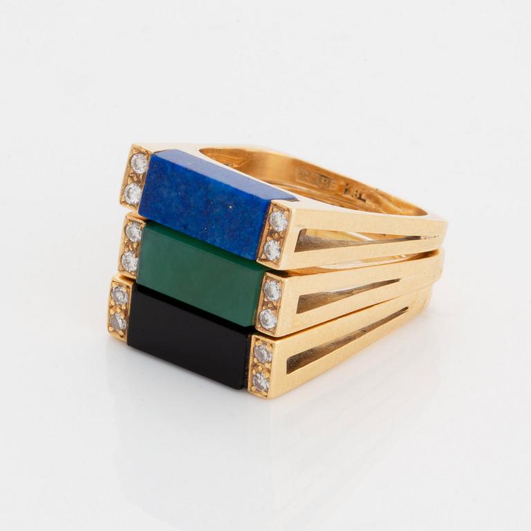 Three rings in 18K gold set with lapis lazuli, onyx and green quartz.