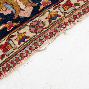 An antique Tabriz carpet, c. 365 x 280 cm.