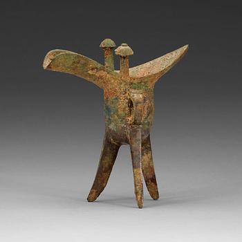 74. A bronze ritural tripod wine vessel 'Jue', presumably Shang dynasty, 12/11th Century BC.