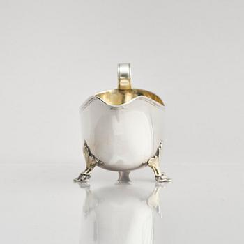 A Swedish early 19th century parcel-gilt cream-jug, mark of Johan Wasserman, Lindesberg, Sweden 1810.