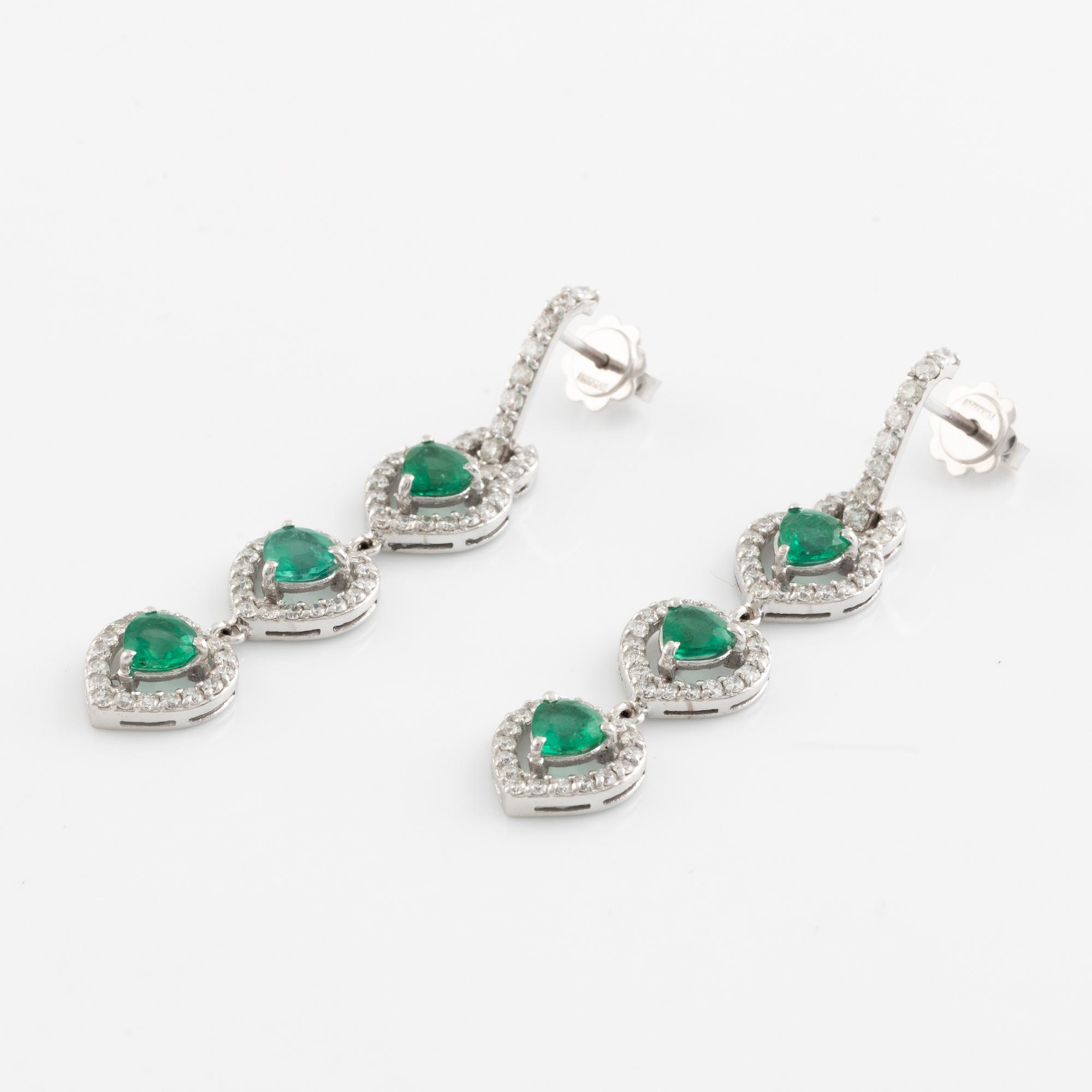 Emerald and brilliant cut diamond earrings.