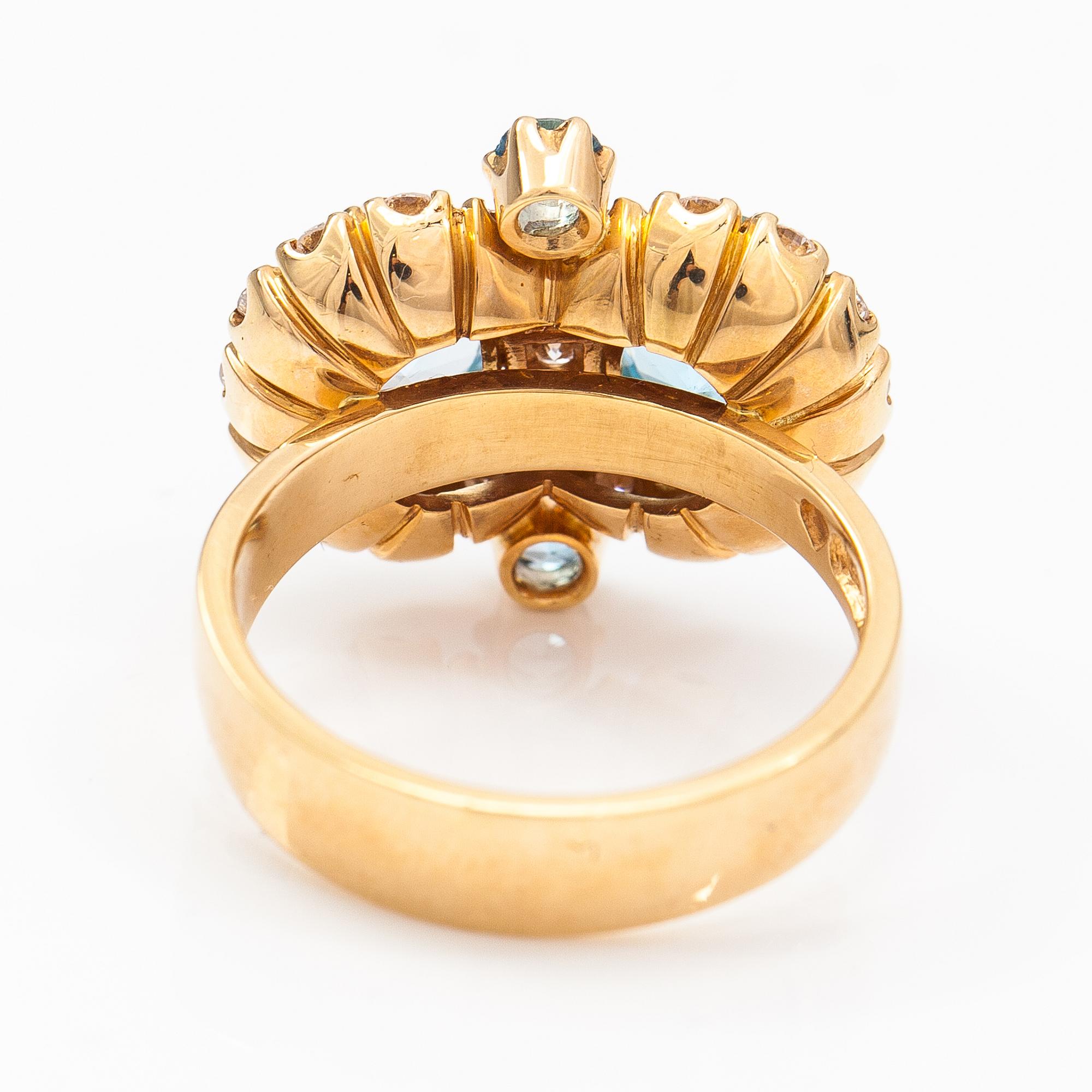 An 18K gold ring "Sophia Albertina" with topazes and diamonds ca. 0.72 ct in total. Ofelia Jewelry, Helsinki 1998.