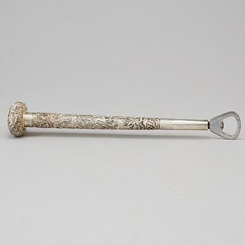 A silver handle for a cane, remodeled in to a can opener, China, 20th Century.