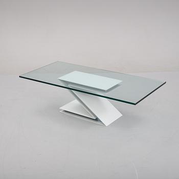 A grey lacquered metal and glass sofa table.
