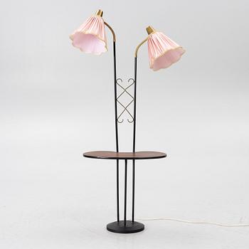 A floor lamp with table, 1940s.