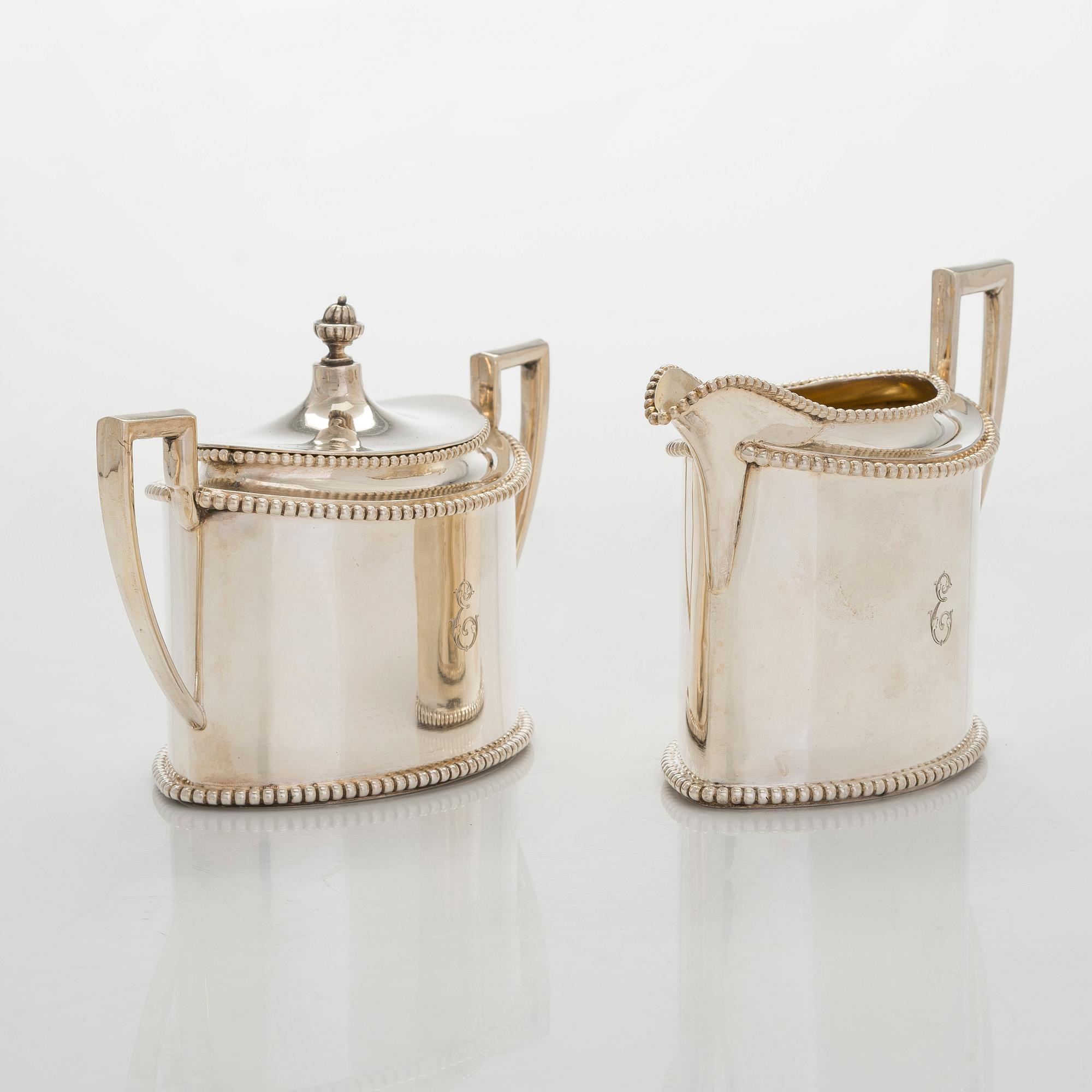 An early 20th century 4- piece sterling silver empire coffee set, C.G. Hallbergs Guldsmeds AB, Stockholm.