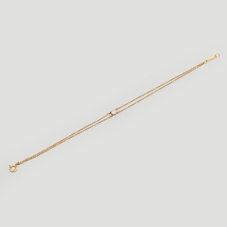 Tiffany & Co, armband, 18K guld med en briljantslipad diamant.
