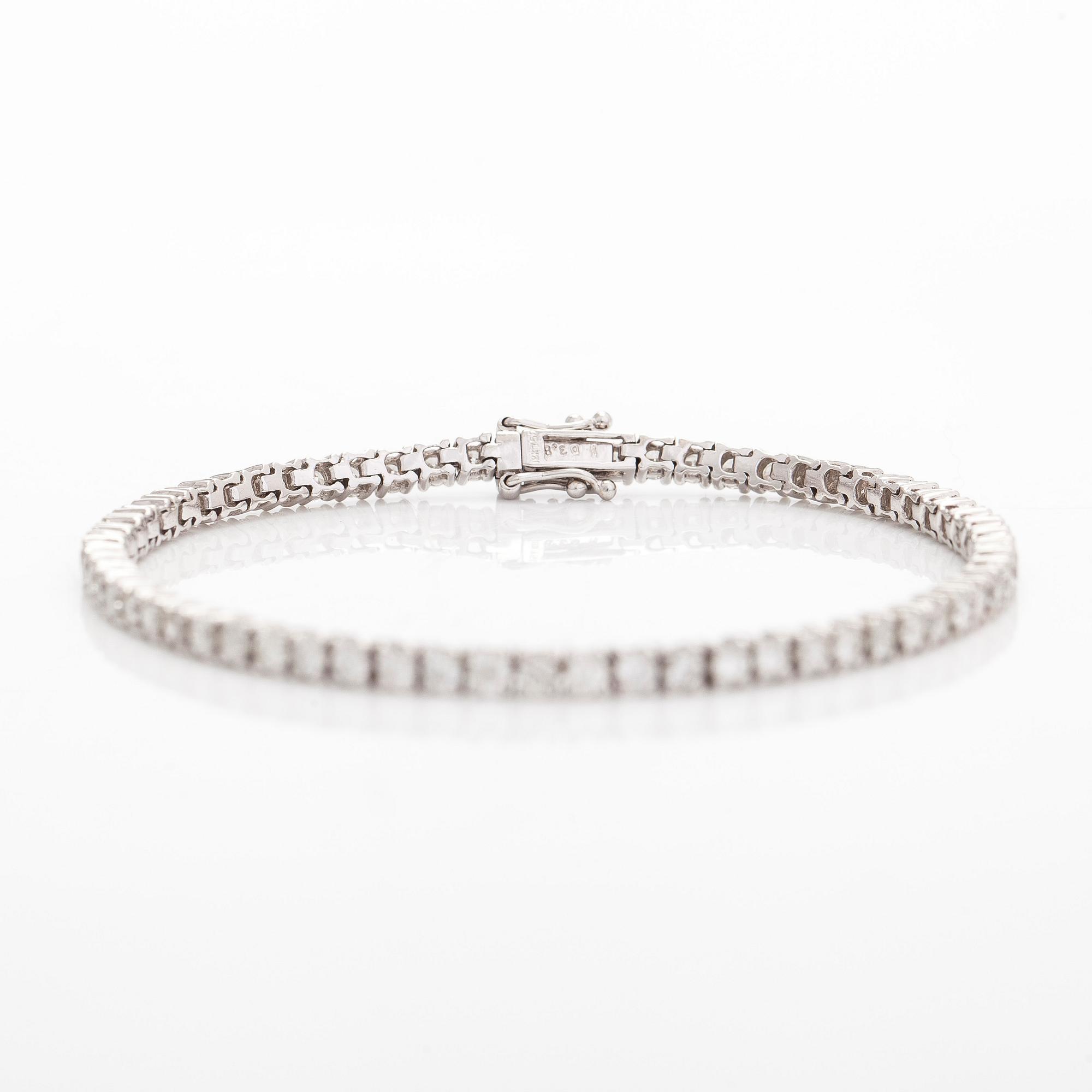 Tennisrannekoru, 18K valkokultaa, briljanttihiontaisia timantteja yhteensä noin 3.84 ct kaiverruksen mukaan.