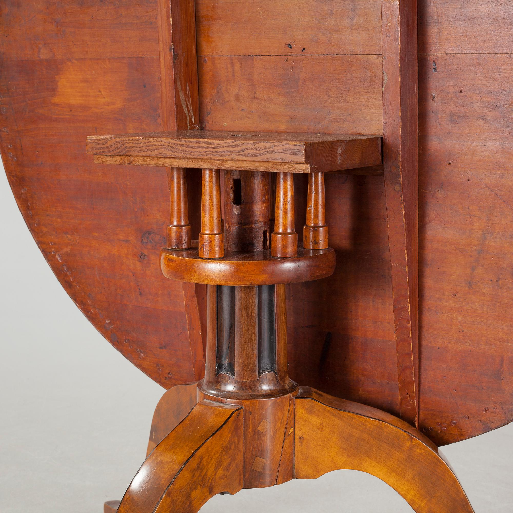 A 19th century drop-leaf table.