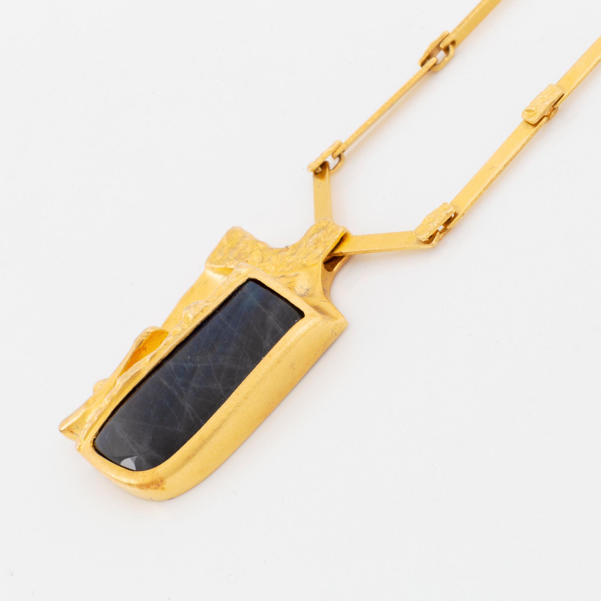 A Lapponia necklace design Björn Weckström in 18K gold set with spectrolite.