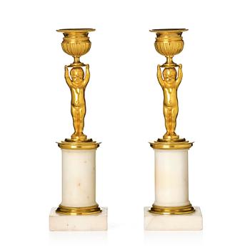 151. A pair of late Gustavian white marble and ormula candlesticks.