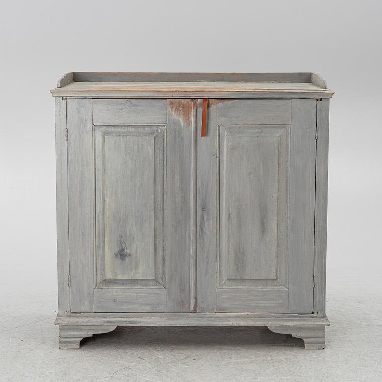 A Gustavian cupboard, circa 1800.