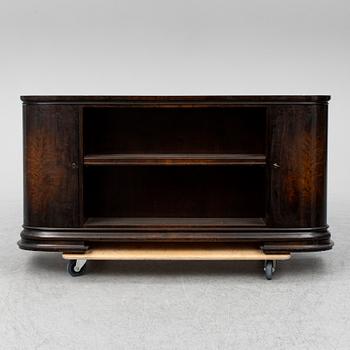 A 1930s stained birch shelf.