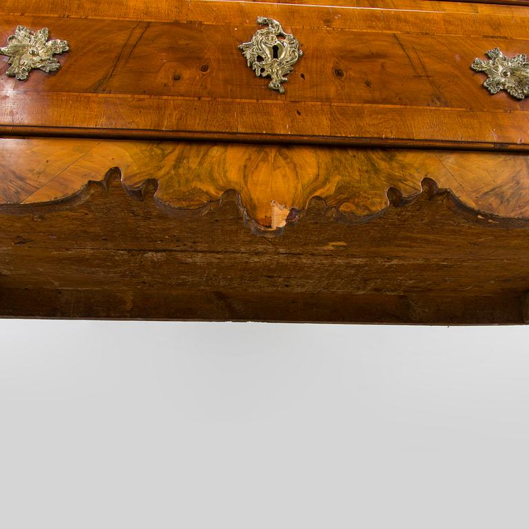 A Swedish walnut-veneered rococo cabinet in the manner of C. Linning, latter half of the 18th Century.