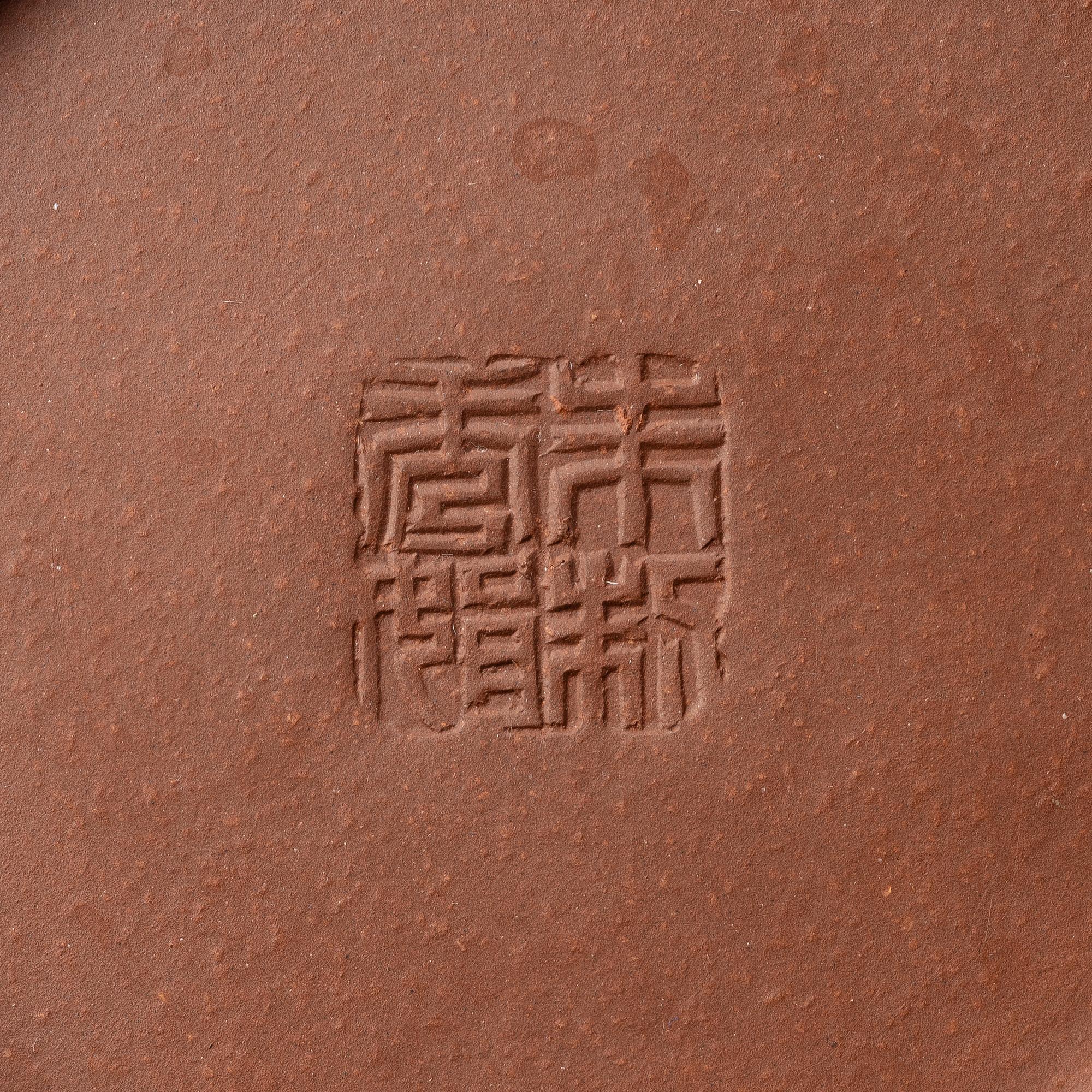 A 'calligraphy' yixing teapot, China, later part of the 1900s.