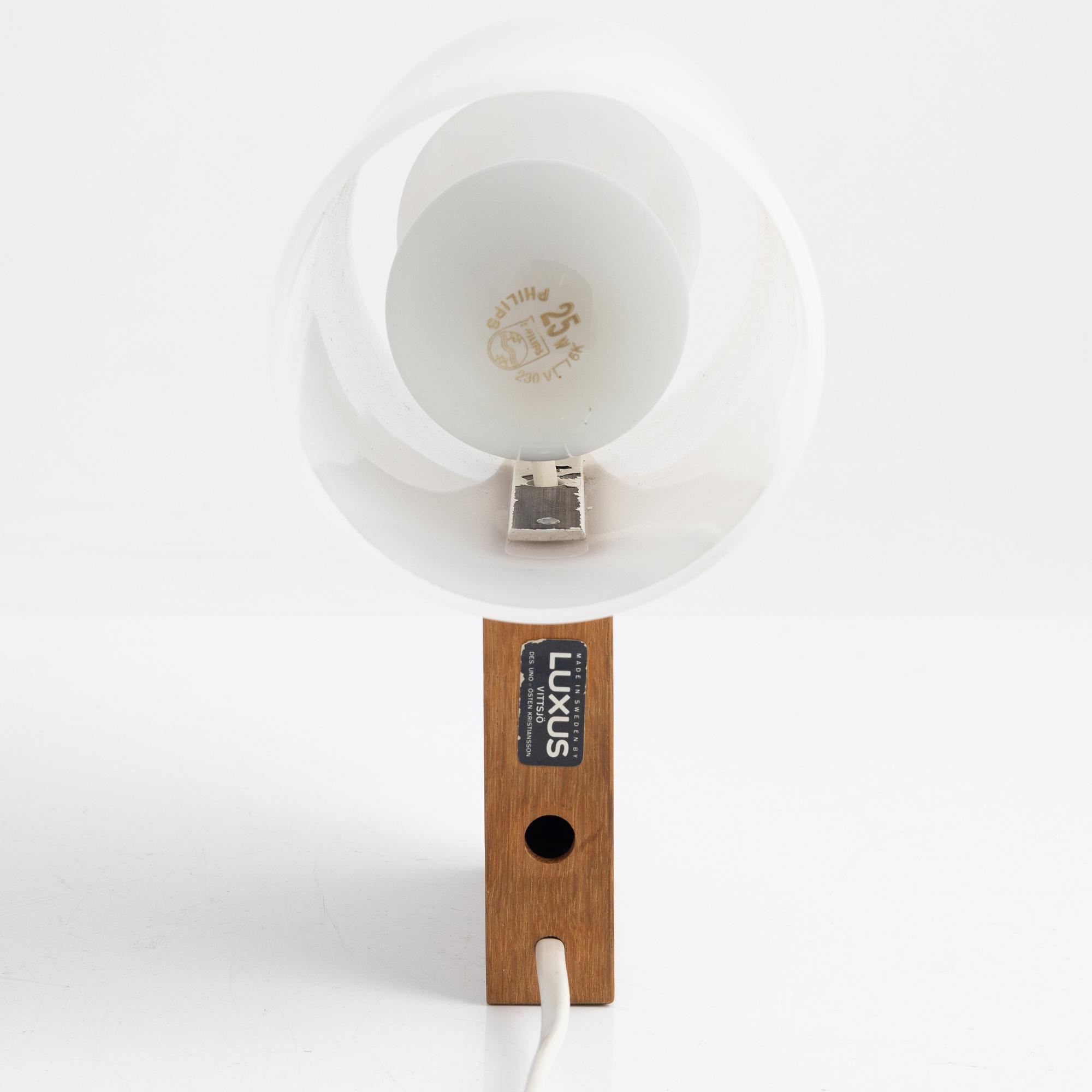 Uno & Östen Kristiansson, a wall light and a table light, Luxus, Vittsjö, Sweden.