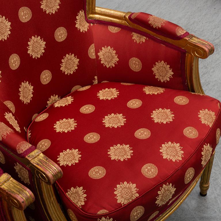 A pair of Louis XVI-style armchairs.