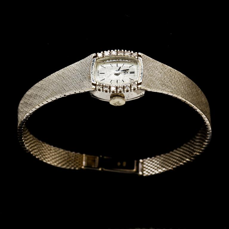 DAMARMBANDSUR, EBEL, 18k vitguld med 12 åttkantslipade diamanter. Vikt 29 g.