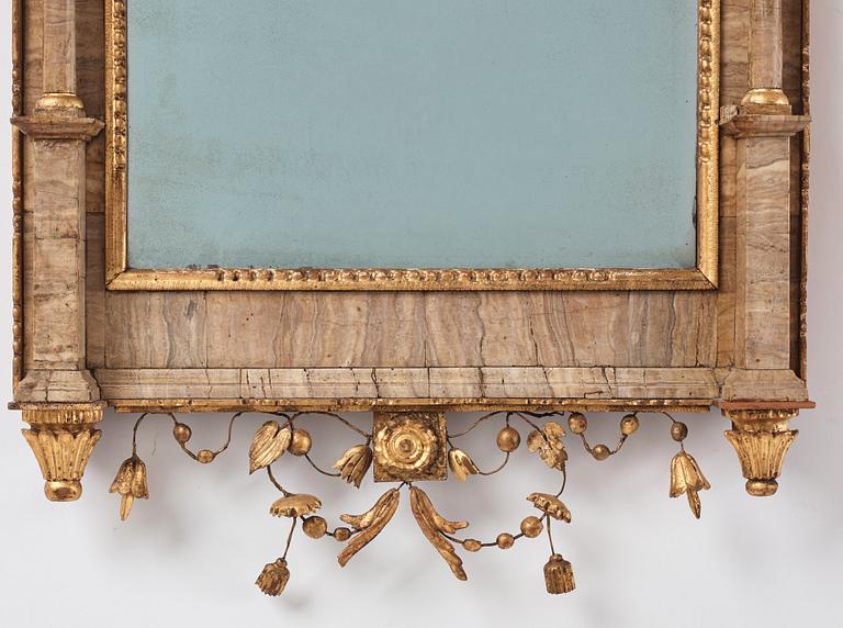 A pair of North-Italian Louis-XVI marble-mounted and carved giltwood mirrors, circa 1800.