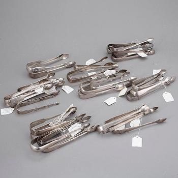 SAMLING SOCKERTÄNGER, 33 st, silver, mest England och London, 1700-1800-tal. Tot ca 1309 gram.