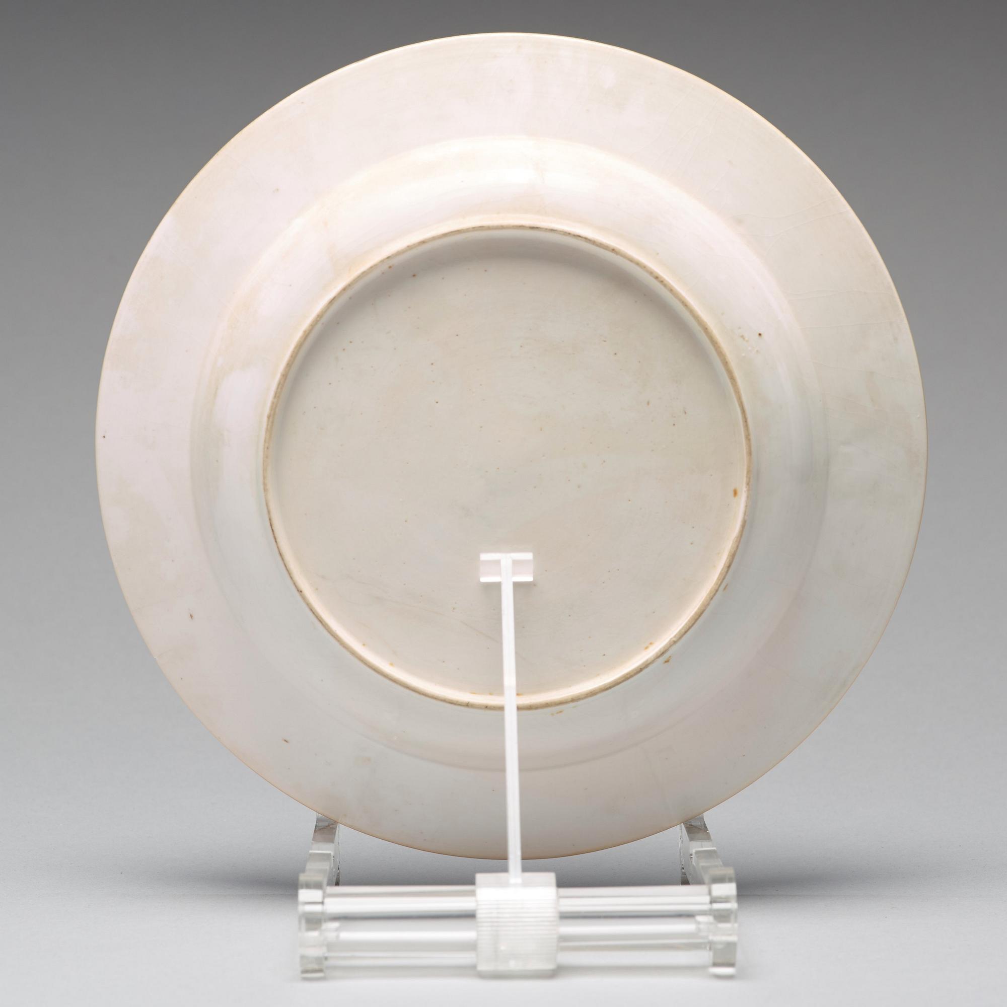 A set of eight blue and white armorial soup dishes, Qing dynasty, 18th Century.
