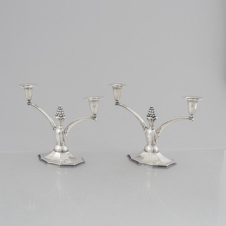 A pair of silver candelabra, Swedish import marks, probably 1920's/30's.
