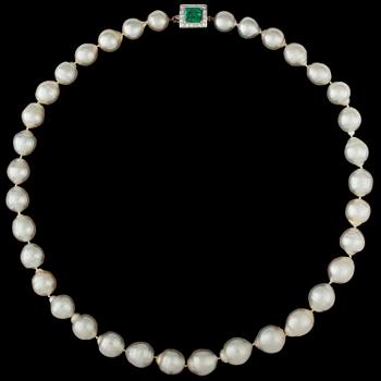 1304. A cultured South sea pearl necklace with emerald and diamond clasp.