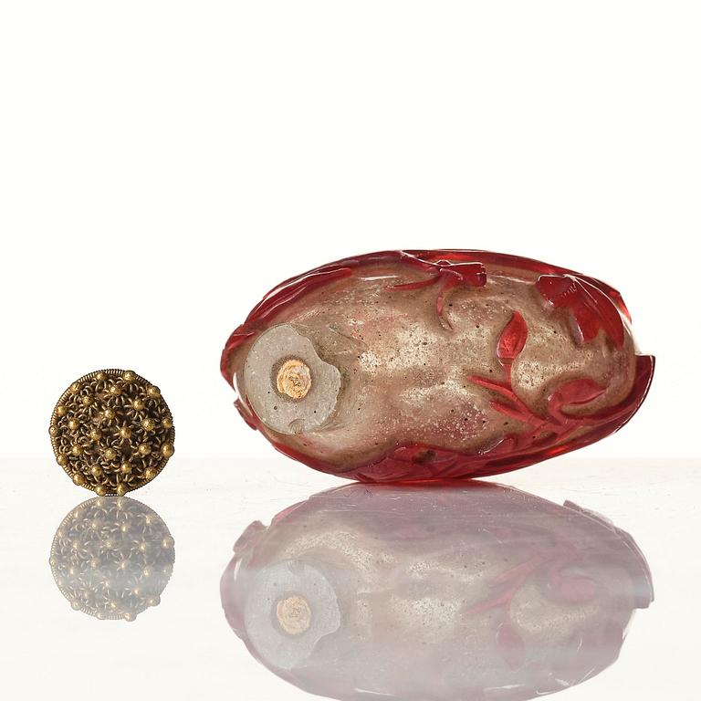 A red overlay Beijing glass snuff bottle, Qing dynasty.