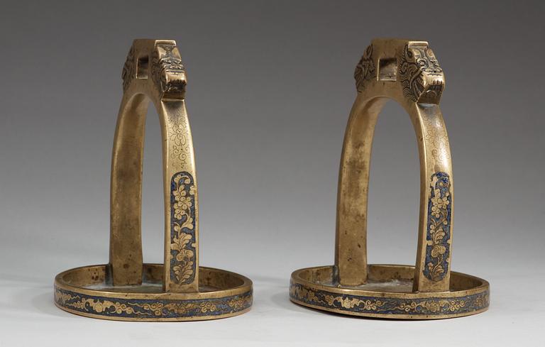 A pair of bronze stirrups with enamel, Qing dynasty, 19th Century.