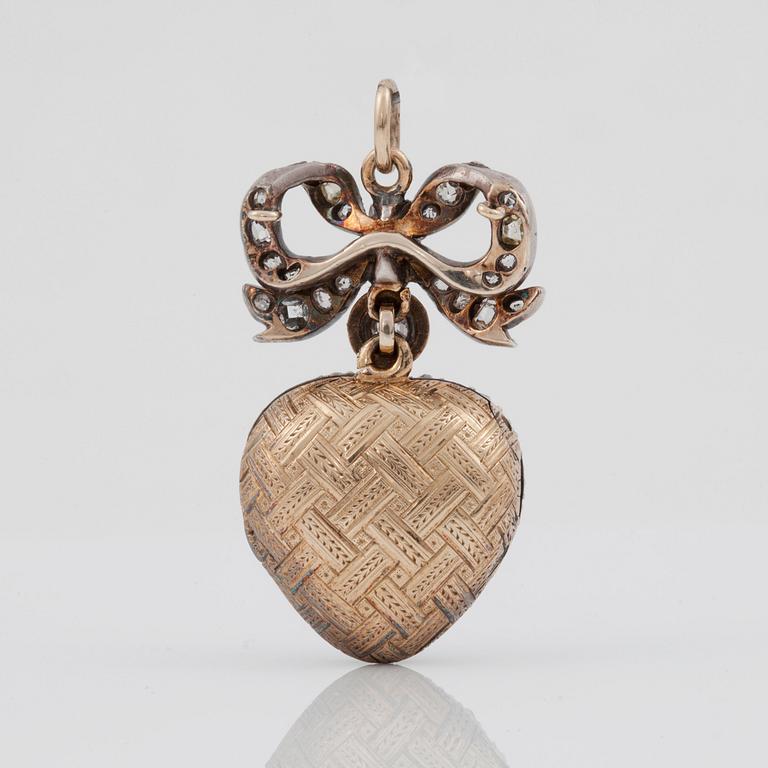 A Victorian pendant locket covered with old-cut diamonds. Center stone circa 1.00 ct.