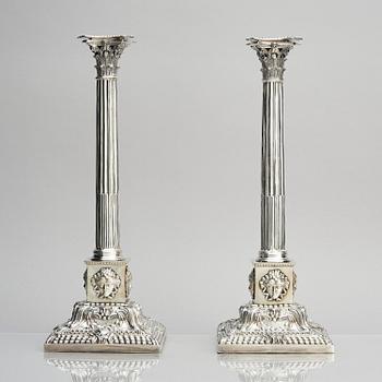 A pair of 18th century silver candlesticks, marks of Ebenezer Coker, London , possibly 1765.