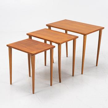 A teak and oak nesting table, 1950s.