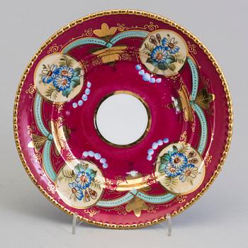 12 Russian porcelain Kuznetsov plates, probably for the Iranian market, late 19th century.