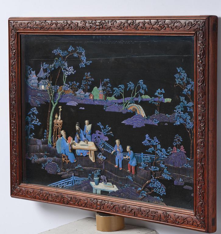 A framed ivory and kingfisher-feather-embellished wall panel, Qing dynasty, Qianlong/Jiaqing.
