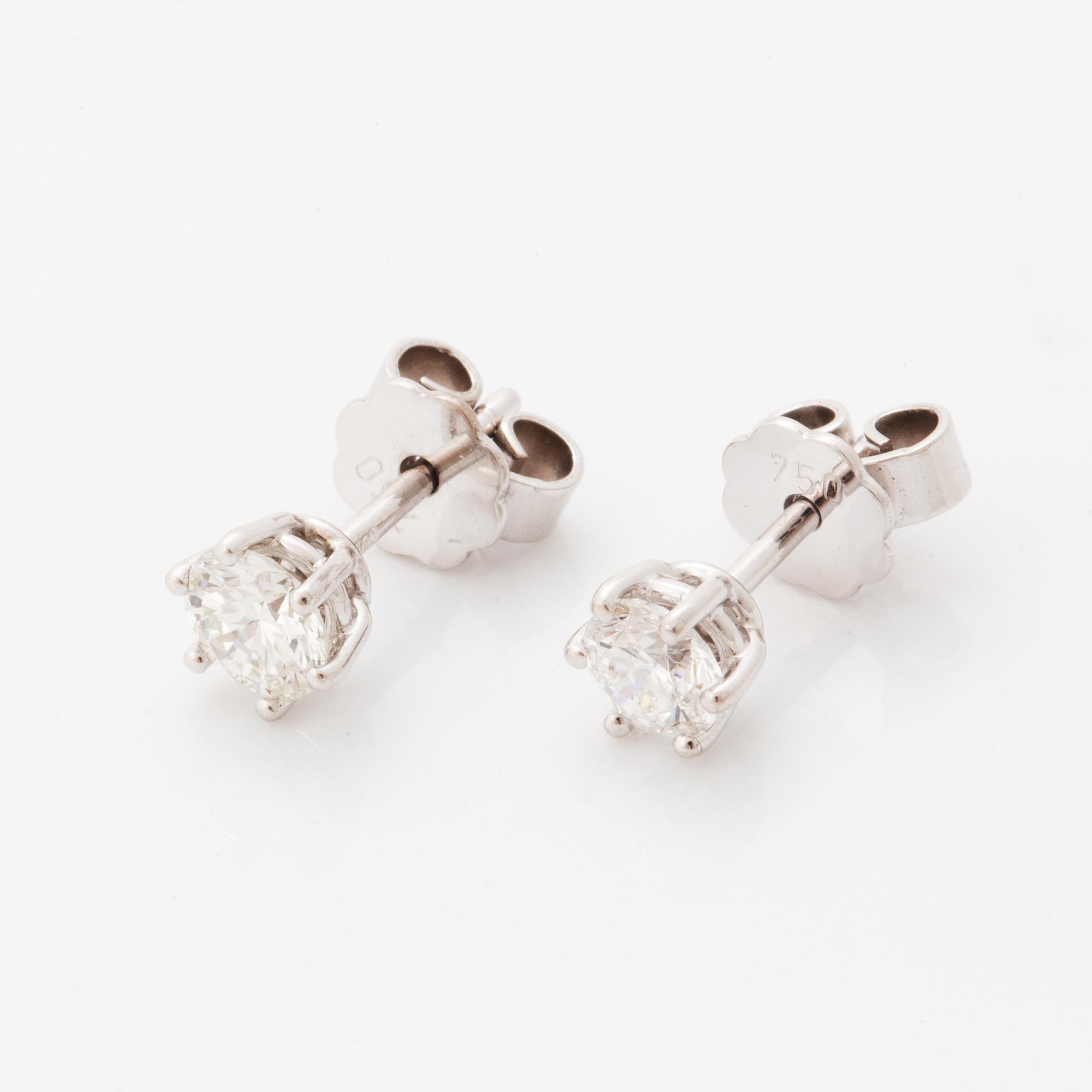 Brilliant-cut diamond stud earrings.