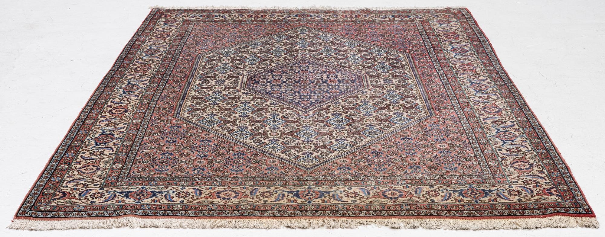 An oriental rug, approx. 238 x 174 cm.